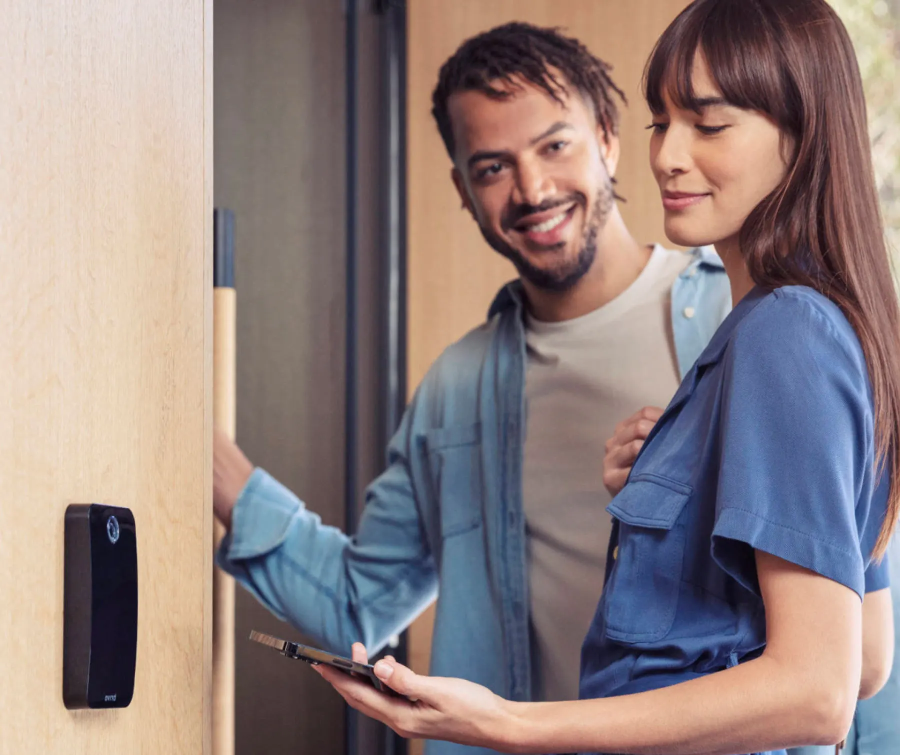 Brivo reader and woman holding phone