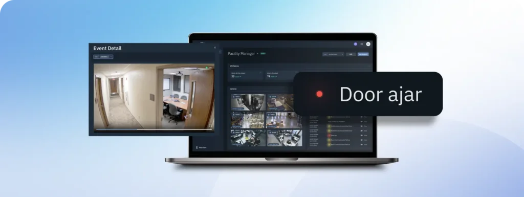 Laptop displaying security surveillance dashboard with live hallway camera feed and a 'Door ajar' alert banner.