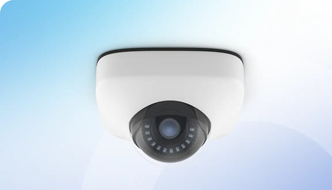 Dome security camera mounted on a ceiling with infrared LEDs surrounding the lens