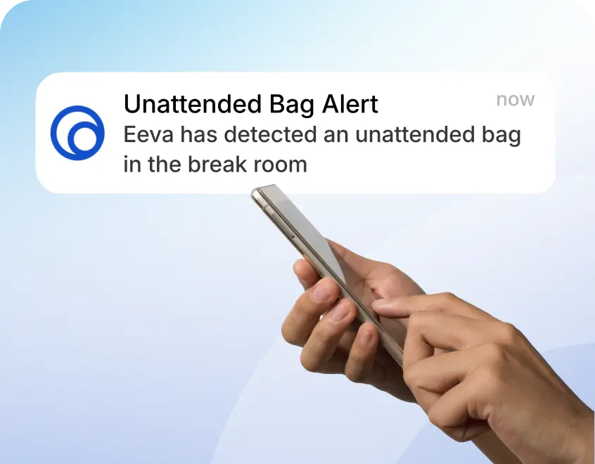 Push notification on a smartphone: 'Unattended Bag Alert' — Eva has detected an unattended bag in the break room.