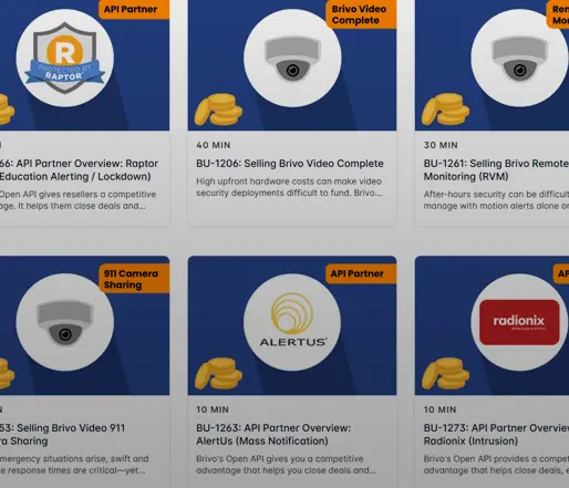 Grid of training video thumbnails with camera icons, logos, and duration labels on blue cards.